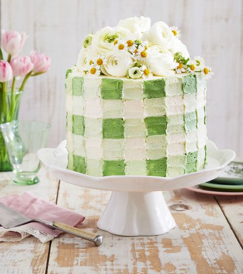 green and white checkered cake on a cake stand