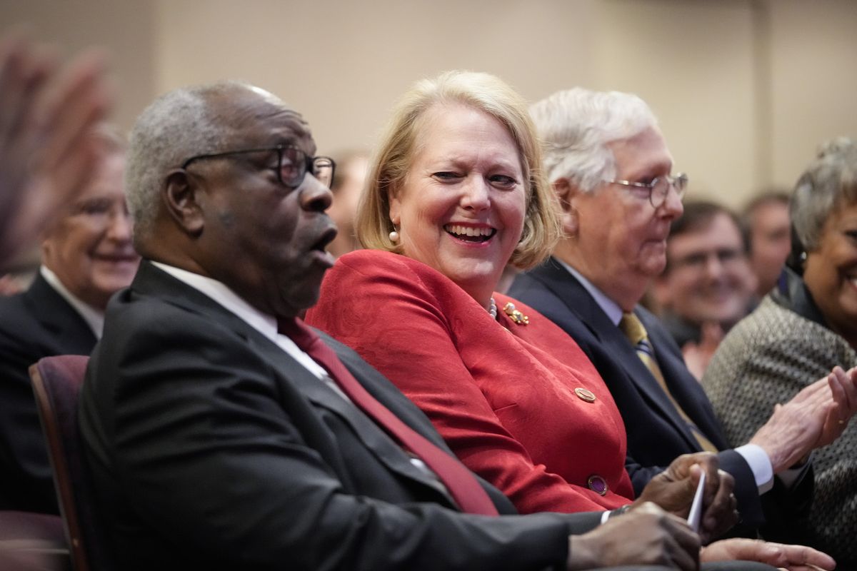 washington, dc   october 21 l r associate supreme court justice clarence thomas sits with his wife and conservative activist virginia thomas while he waits to speak at the heritage foundation on october 21, 2021 in washington, dc clarence thomas has now served on the supreme court for 30 years he was nominated by former president george h w  bush in 1991 and is the second african american to serve on the high court, following justice thurgood marshall photo by drew angerergetty images