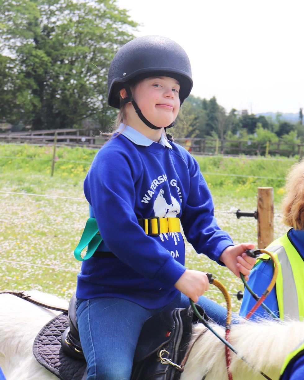 Child, Horse, Recreation, Equestrianism, Smile, Helmet, Plant, Competition event, Vehicle, Leisure, 