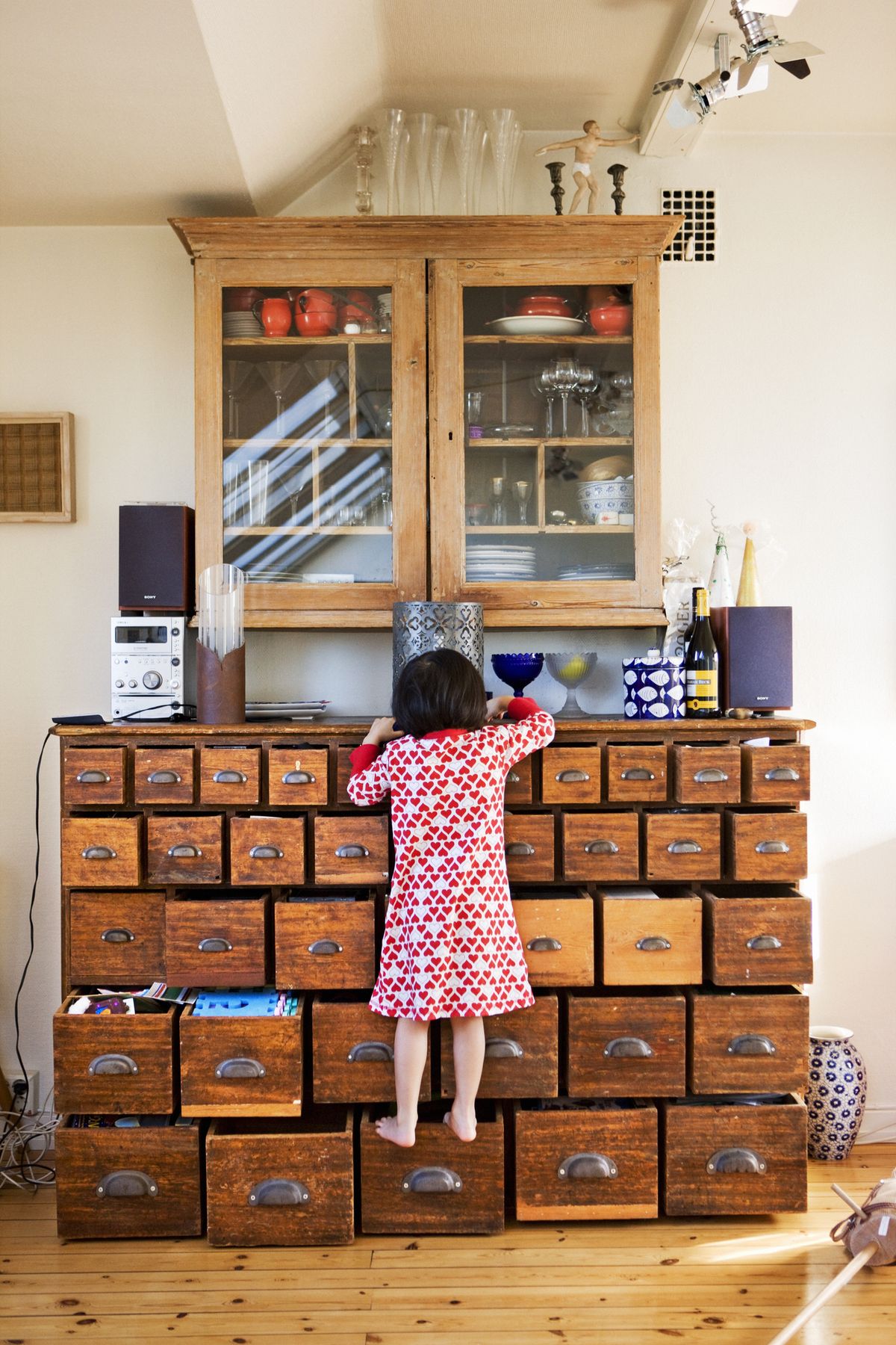 girl climbing drawer