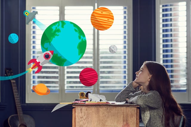 Girl dreaming about space and planets