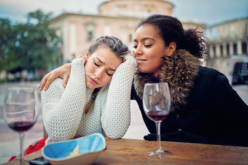 Girl is consoling her girlfriend after break up