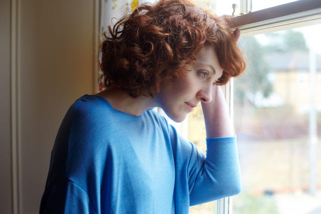 Girl looking out of window