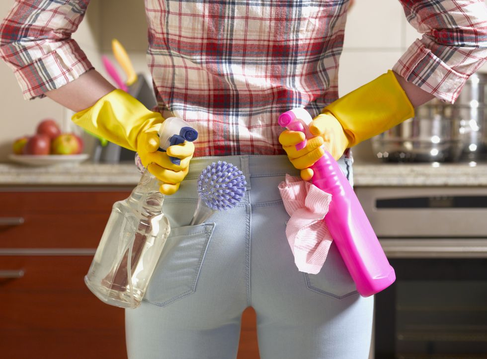 girl preparing to spring clean kitchen