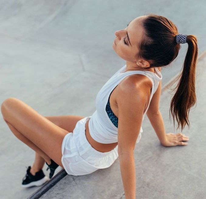 Girl relaxing after intense workout session