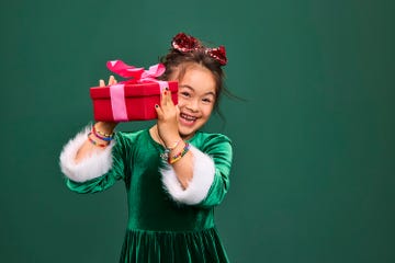 girl shaking wrapped red present