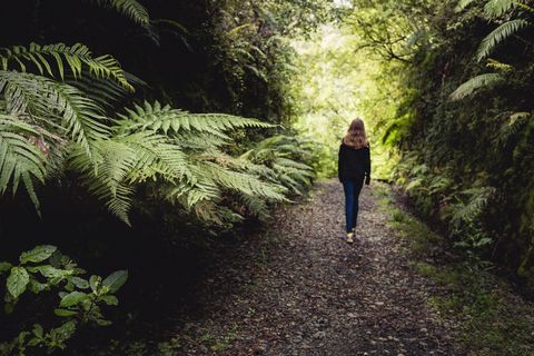 girl walking in forest