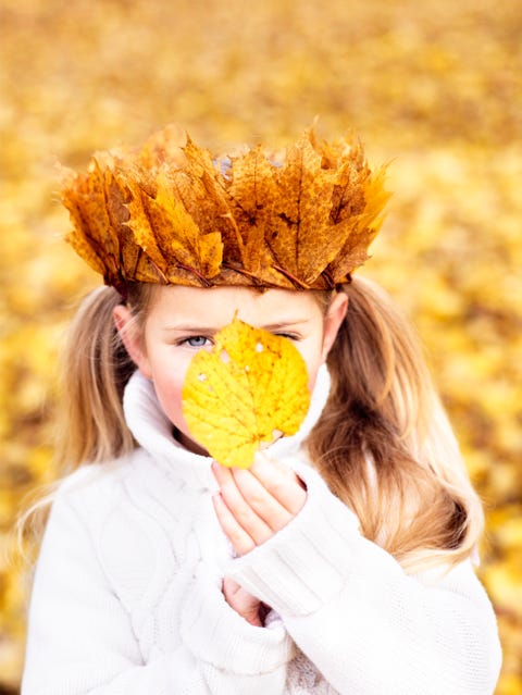 girl wearing a crown of autumn leaves