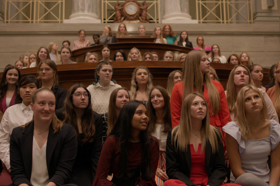 the participants gathered for girls state assembly in the documentary film girls state