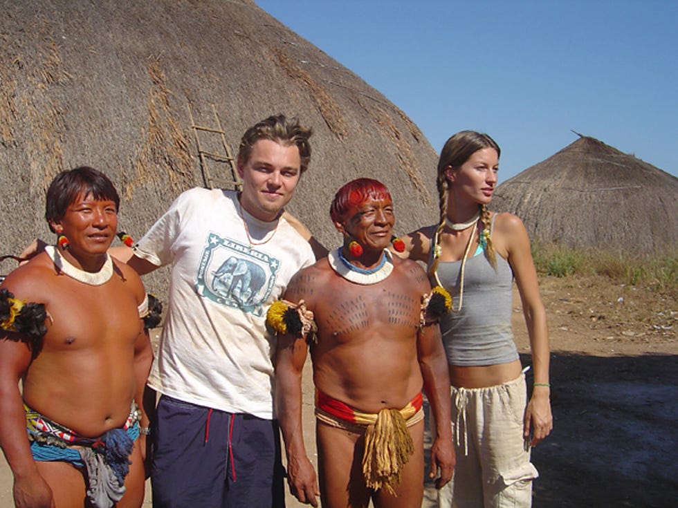 Gisele Bundchen and Leonardo DiCaprio with Xingu Indians in the Amazon Rainforest