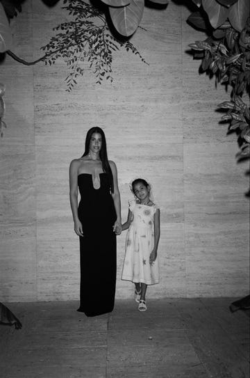 a black and white photo of gabriella khalil and daughter