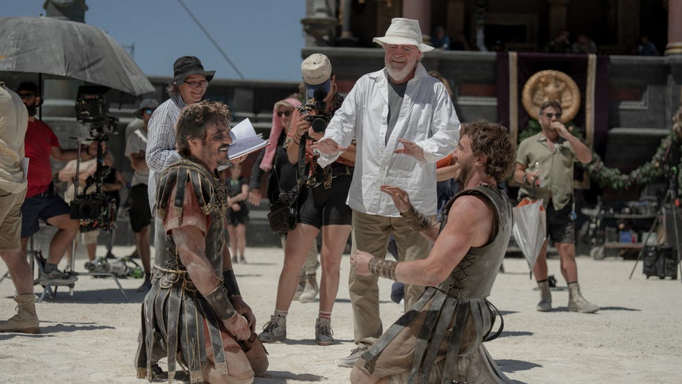 film set with actors in gladiator costumes and crew members