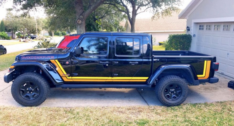 black jeep gladiator with stripes