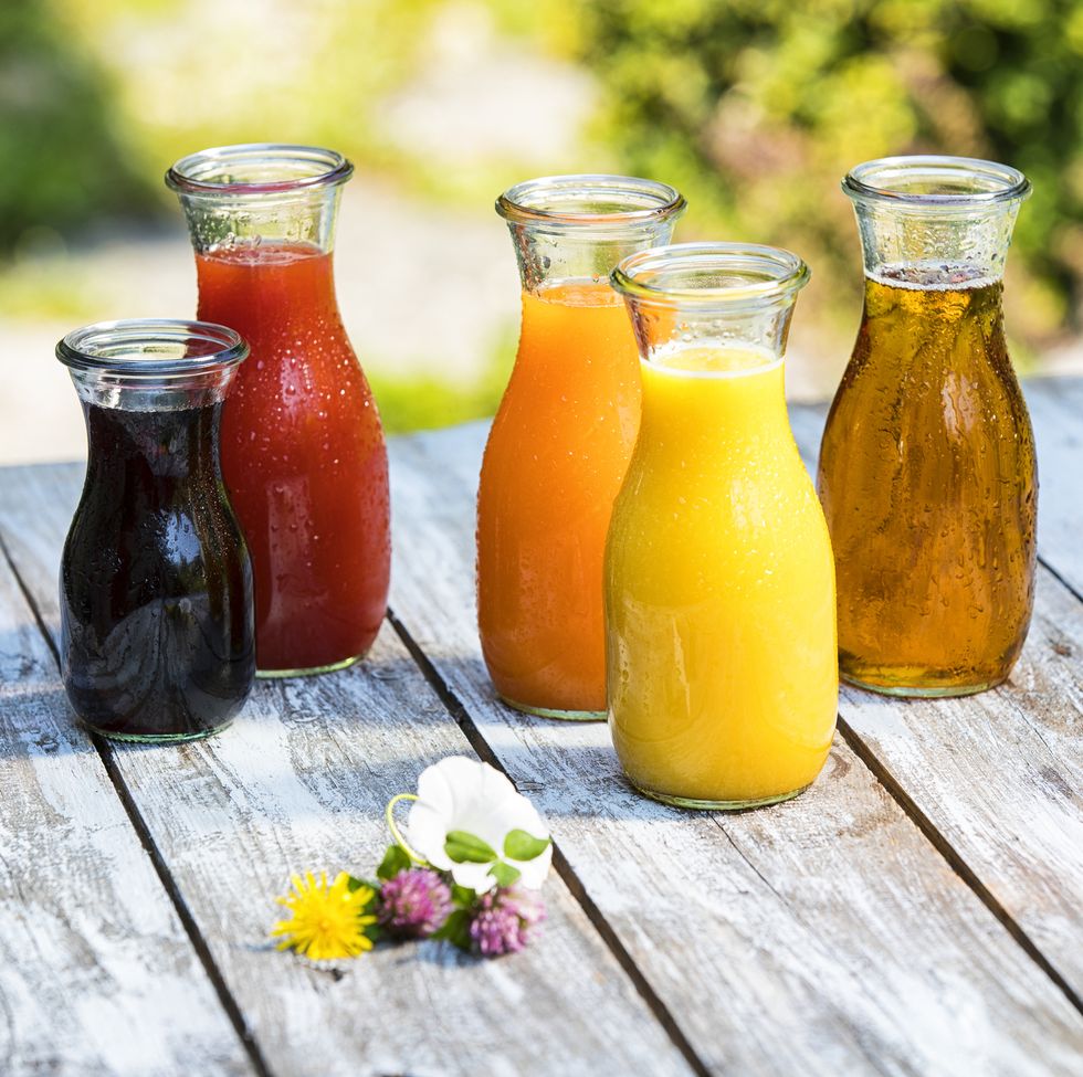 glass bottles of various fruit juices