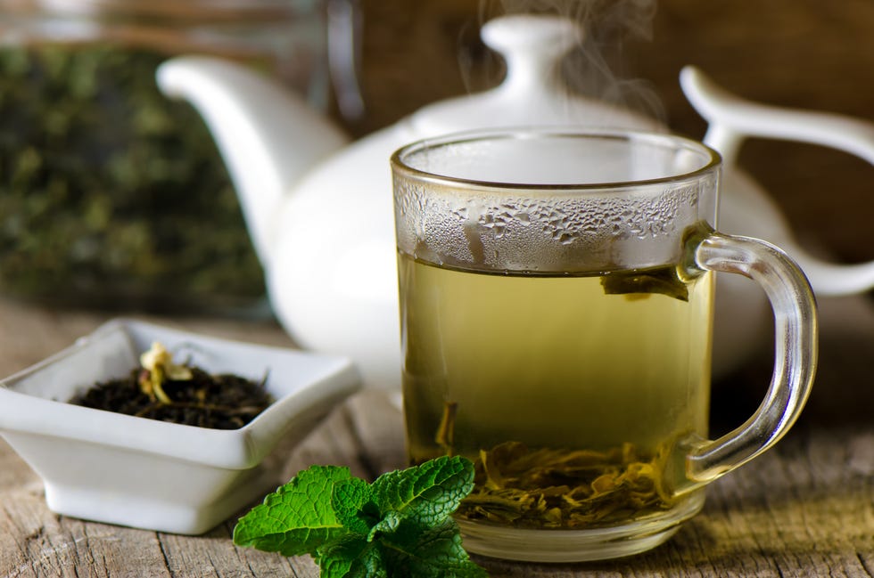 glass cup with fresh green tea