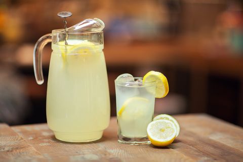 glass jar and glass with fresh lemonade