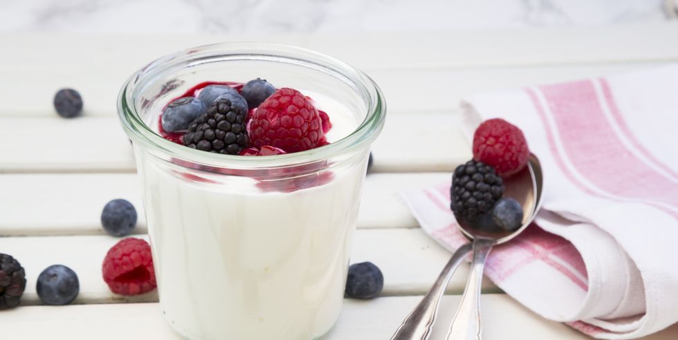 glass of greek yogurt with berries