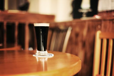 glass of guinness on pub table