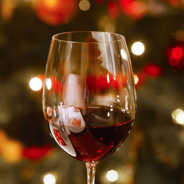 Glass of red wine at Christmas time, close-up