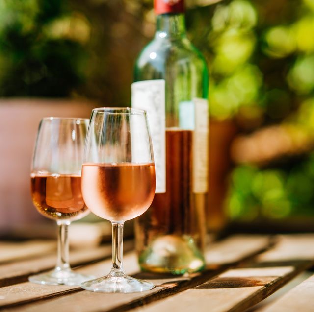 glass of wine on a table in sunlight