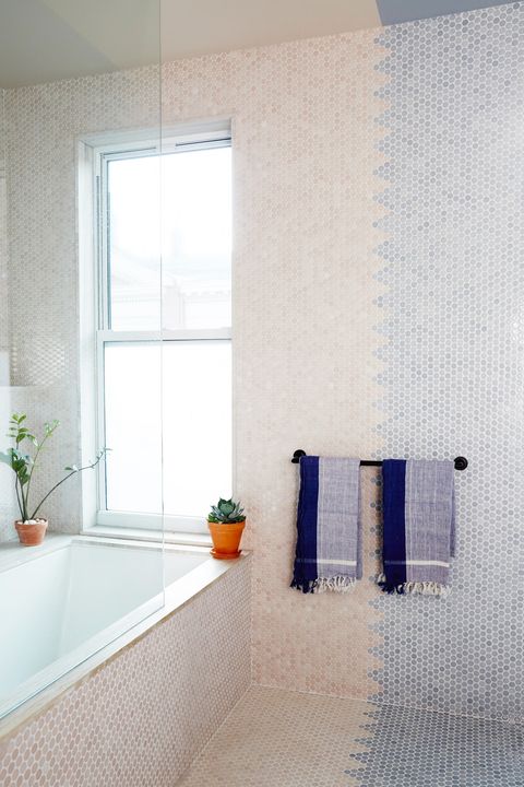 bathroom with pink and blue penny tiles and glass shower
