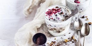 Glasses of yogurt dessert with chia, roasted hazelnuts and