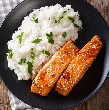 glazed salmon fillet with rice garnish vertical top view
