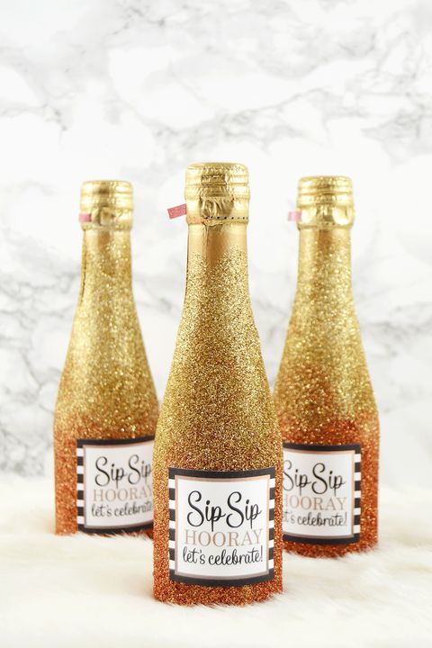 glitter mini champagne bottles engagement party ideas