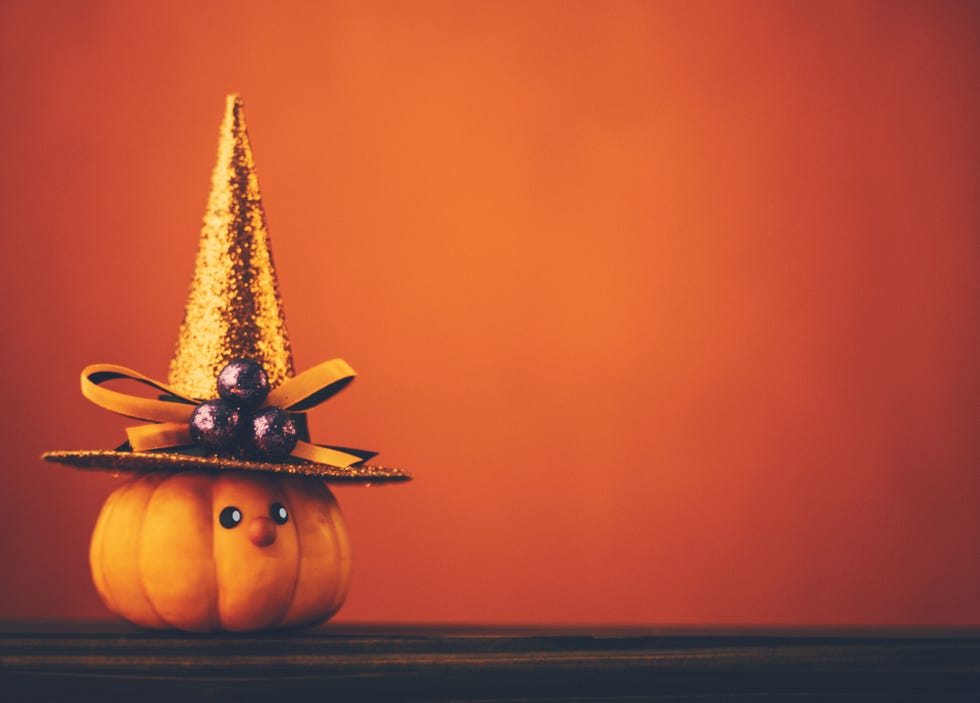 halloween background with cute pumpkin witch
