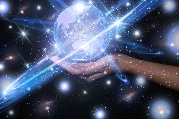 a planet hologram hovering over a person's palm