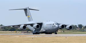 A USAF C-17A Globemaster strategic transport aircraft taxing along a runway at RNAS Yeovilton, Somerset, England, UK, The jet will form in the static display on Saturdays airshow at the base