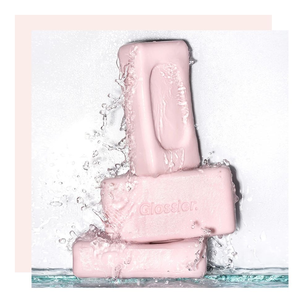 3 glossier exfoliating bars splashed with water