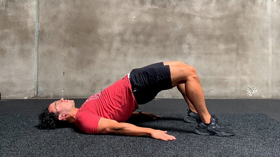 man performing glute bridge execrise