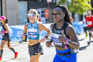 a woman wearing running clothing competing in a race