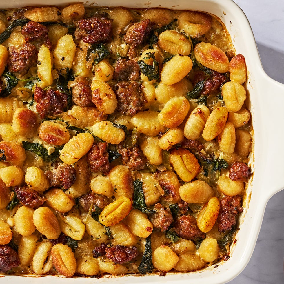 gnocchi and sausage stuffing in a white baking dish