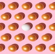 golden eggs on the pink background