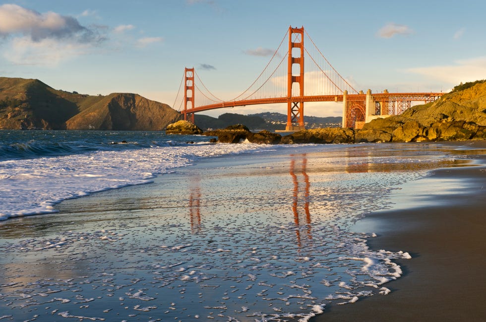 Golden Gate Bridge reflected on wet sand Golden Gate Bridge reflected on wet sand