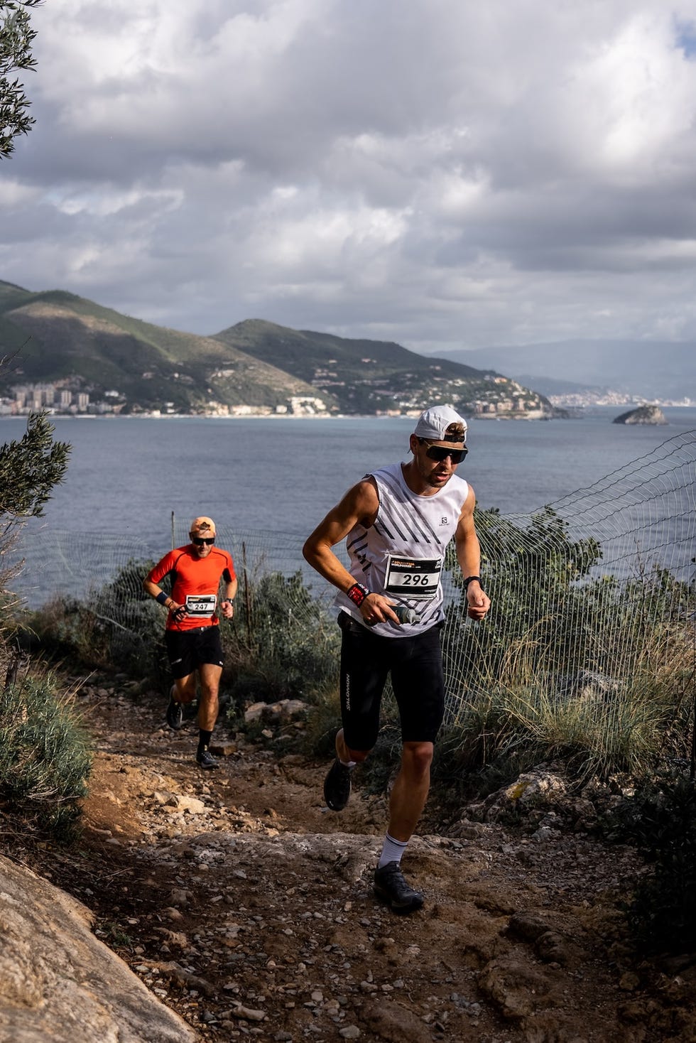 two runners competing on a scenic trail