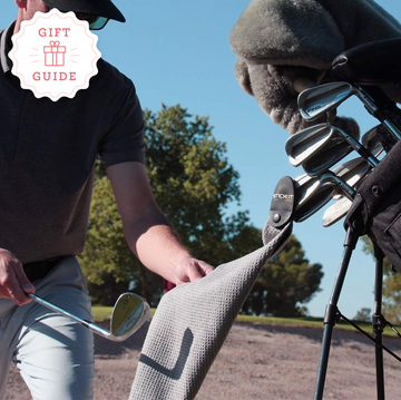 the stickit magnetic golf towel and on course golf drinking game are two good housekeeping picks for best golf gifts