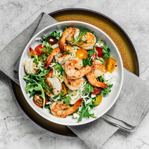 shrimp salad in a bowl on white background
