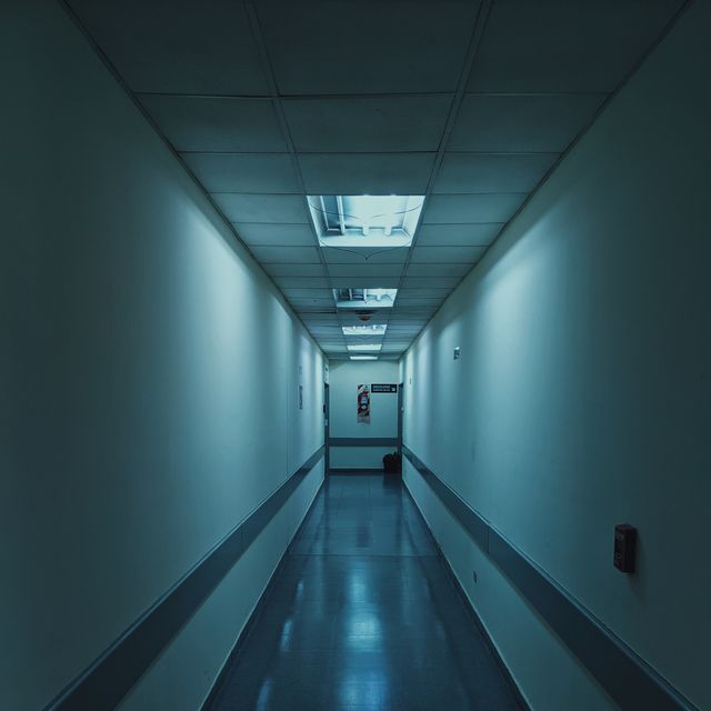 a long hallway with a person walking