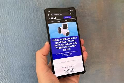 hand holding google pixel 6a with best products homepage on display