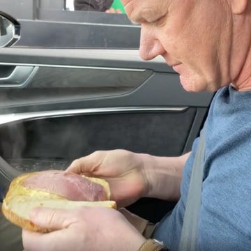 gordon ramsay in a car holding a sandwich gordon ramsay in a car holding a sandwich