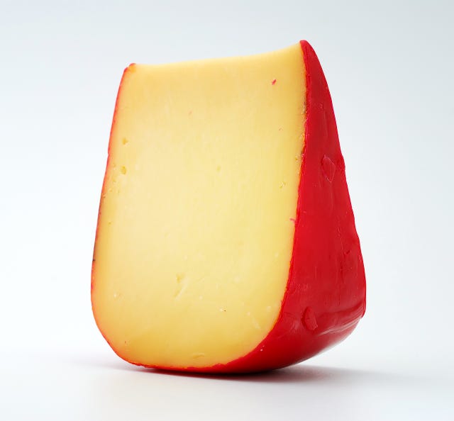 a piece of gouda cheese