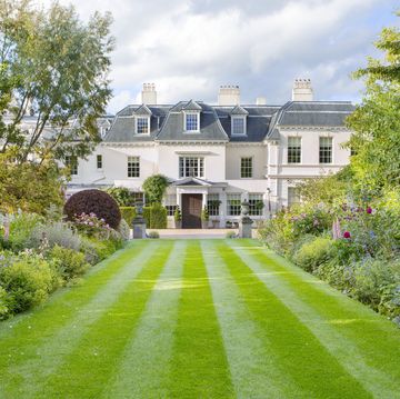 italianate estate in goudhurst, england design by jo thompson landscape garden design a double herbaceous border with purple berberis, ornamental grasses, agastache, roses, nepeta, and other perennials defines the entry