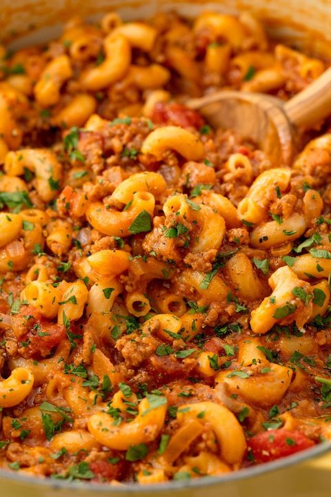 closeup of tomato beef macaroni goulash topped with chopped parsley