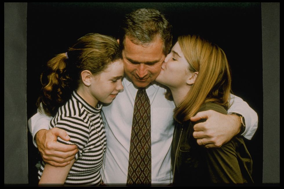 George W. Bush Hugging Daughters