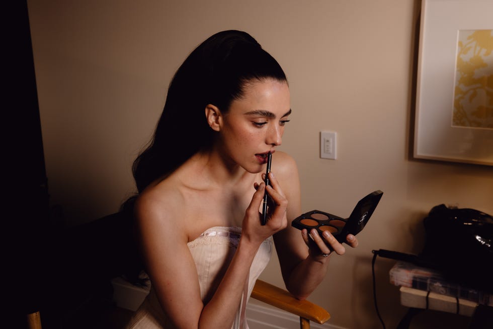 application of makeup using a compact