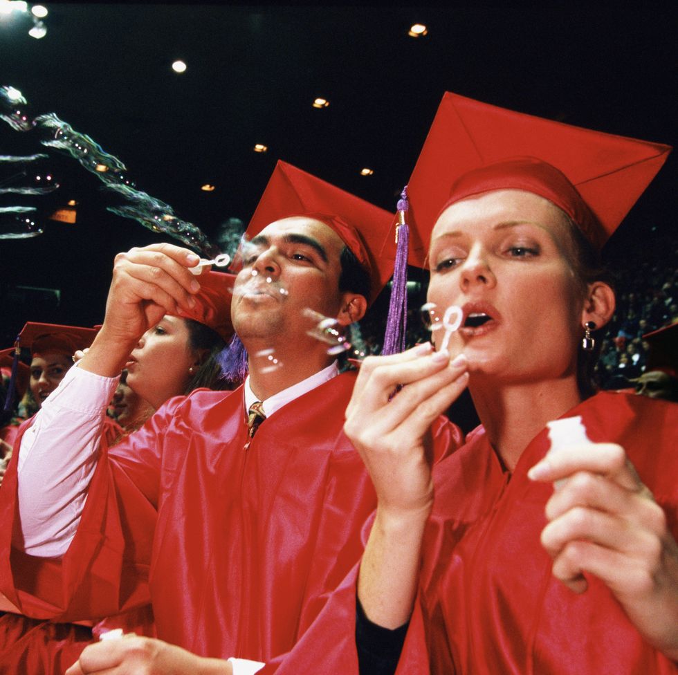 graduates blowing bubbles