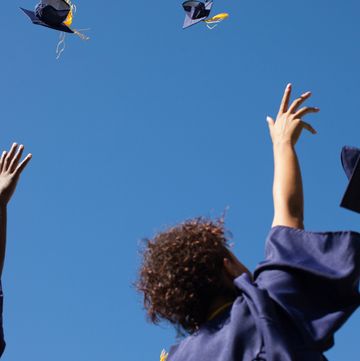 grads throwing their caps in the air
